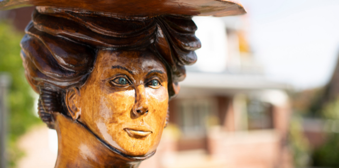 Woman's face in a tree sculpture